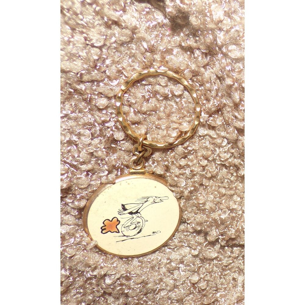 vintage metal BC comic caveman on wheel Keychain Key Ring